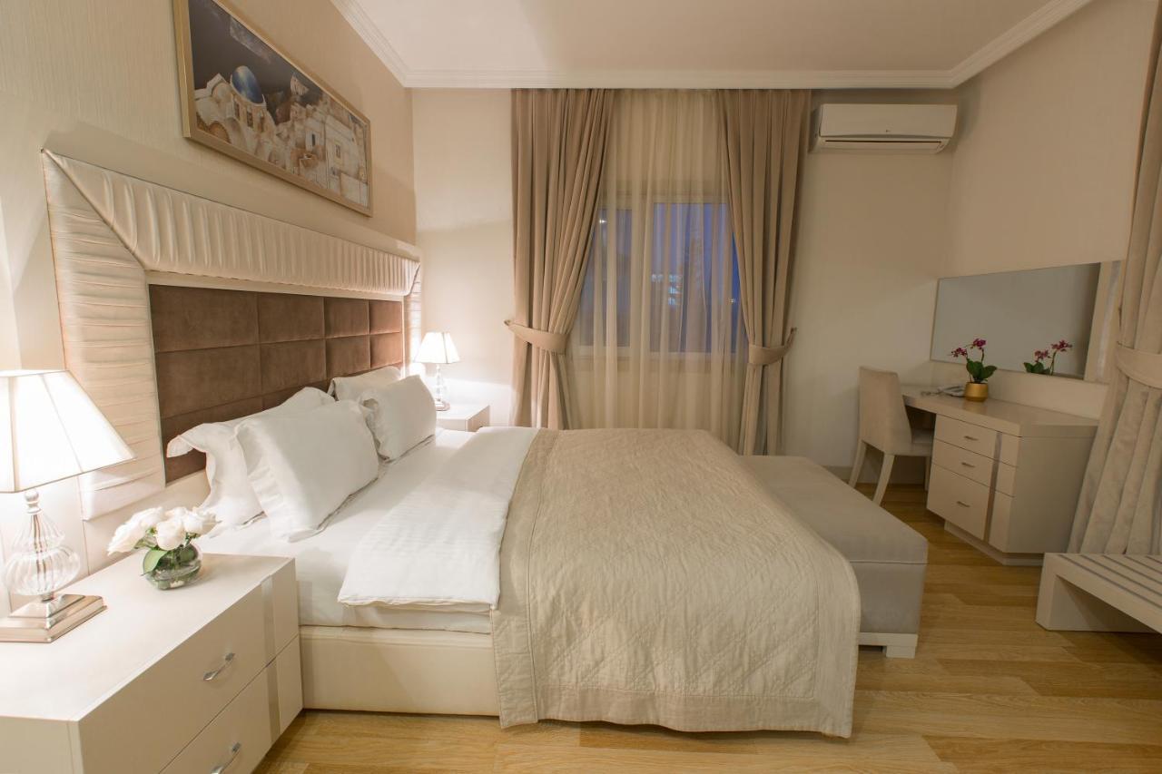 Gabala Garden Hotel Exteriör bild A bedroom in a hotel