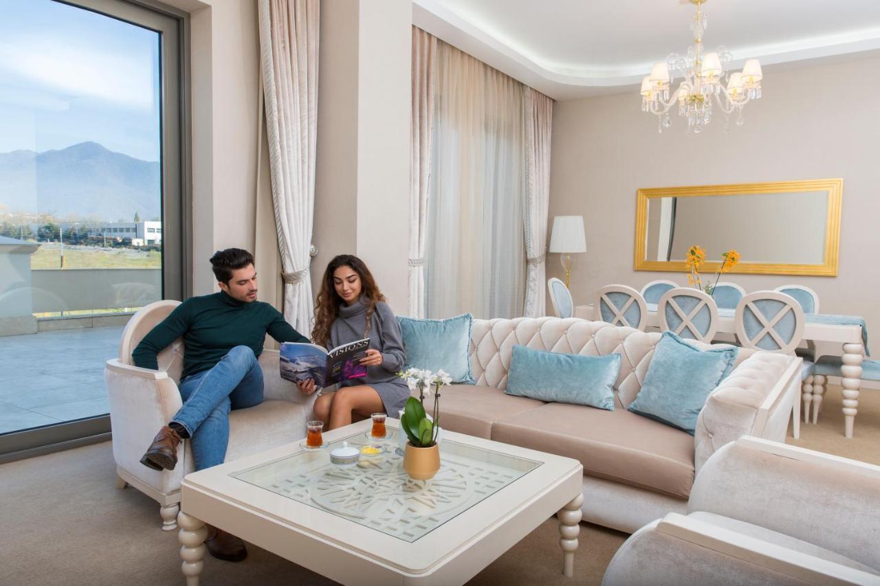 Gabala Garden Hotel Exteriör bild A living room in a hotel suite