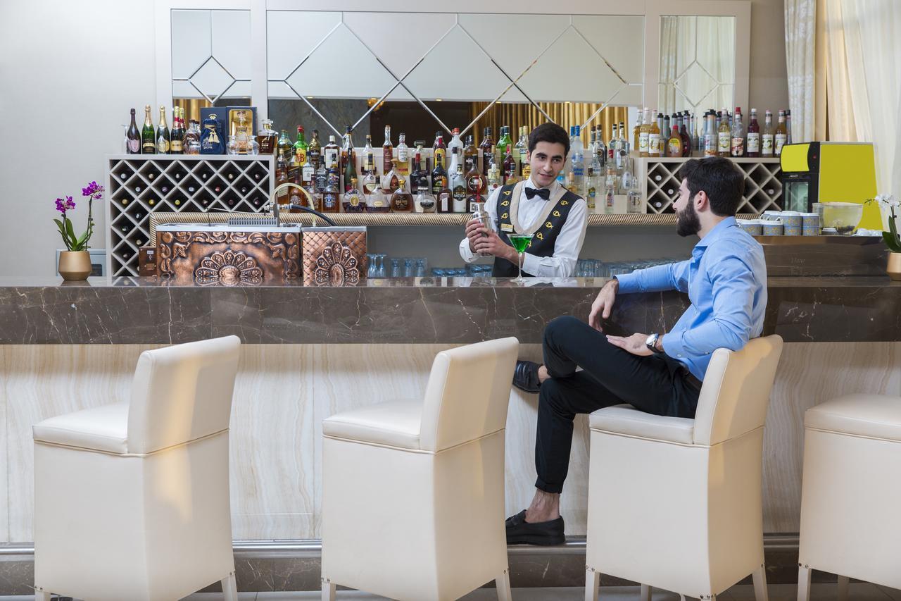 Gabala Garden Hotel Exteriör bild A bartender at work