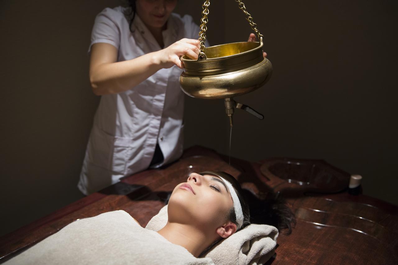 Gabala Garden Hotel Exteriör bild A woman receiving a head massage